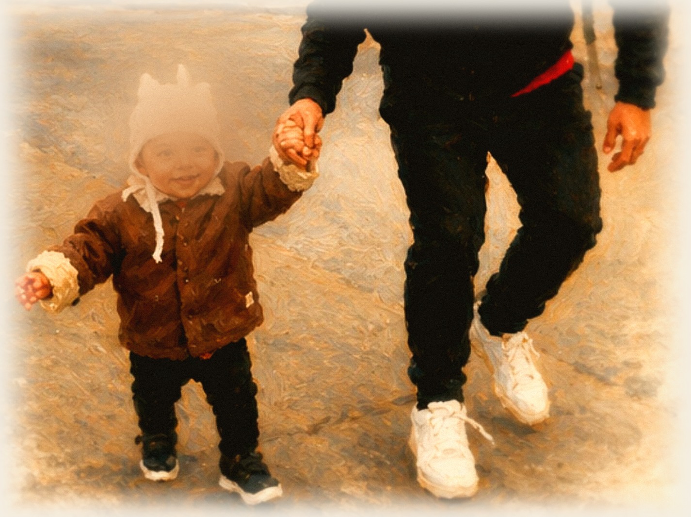 A parent and child walking hand in hand